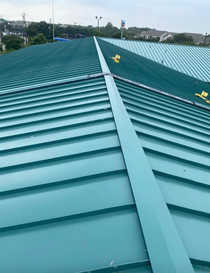 Green commercial metal roof ridge and valley for Metal Roof Repair in Bedford